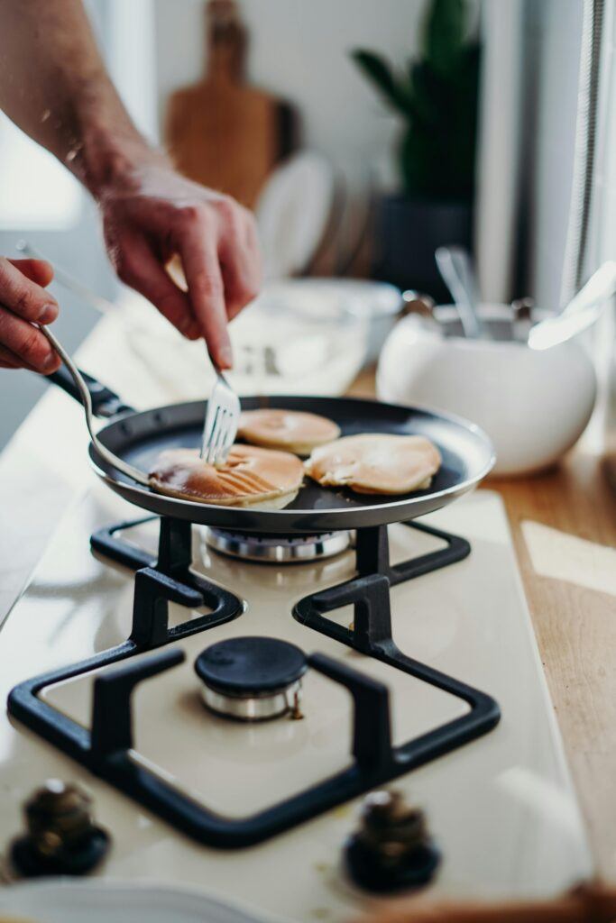 flipping pancakes in the pan